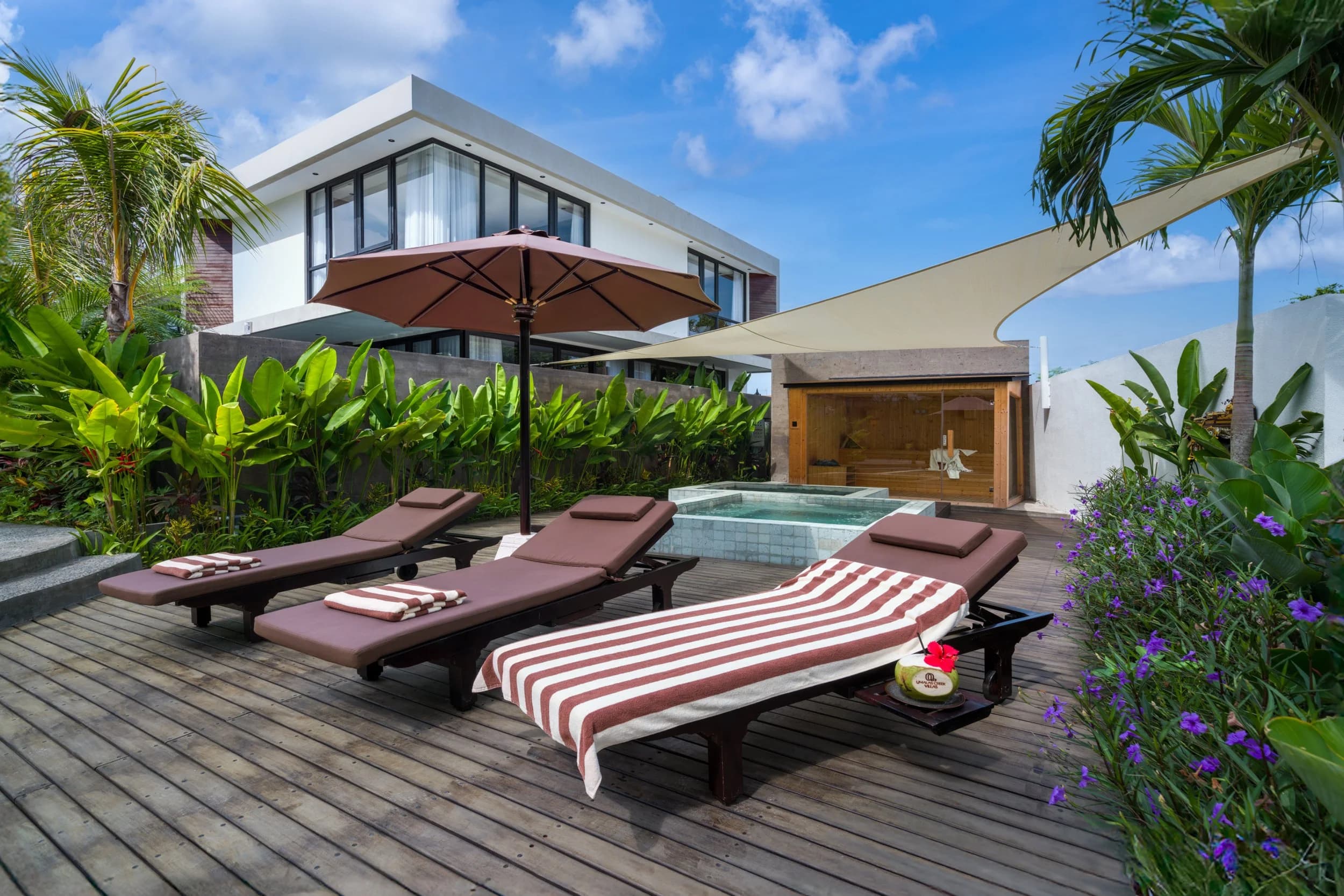 Sun loungers beside the plunge pool and sauna at Umalas Creek